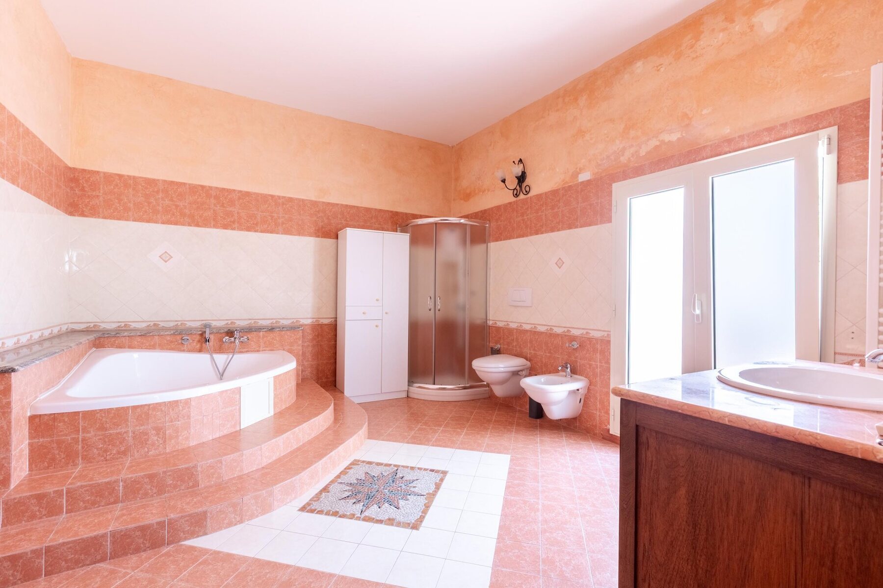 Bathroom with a large window overlooking the garden