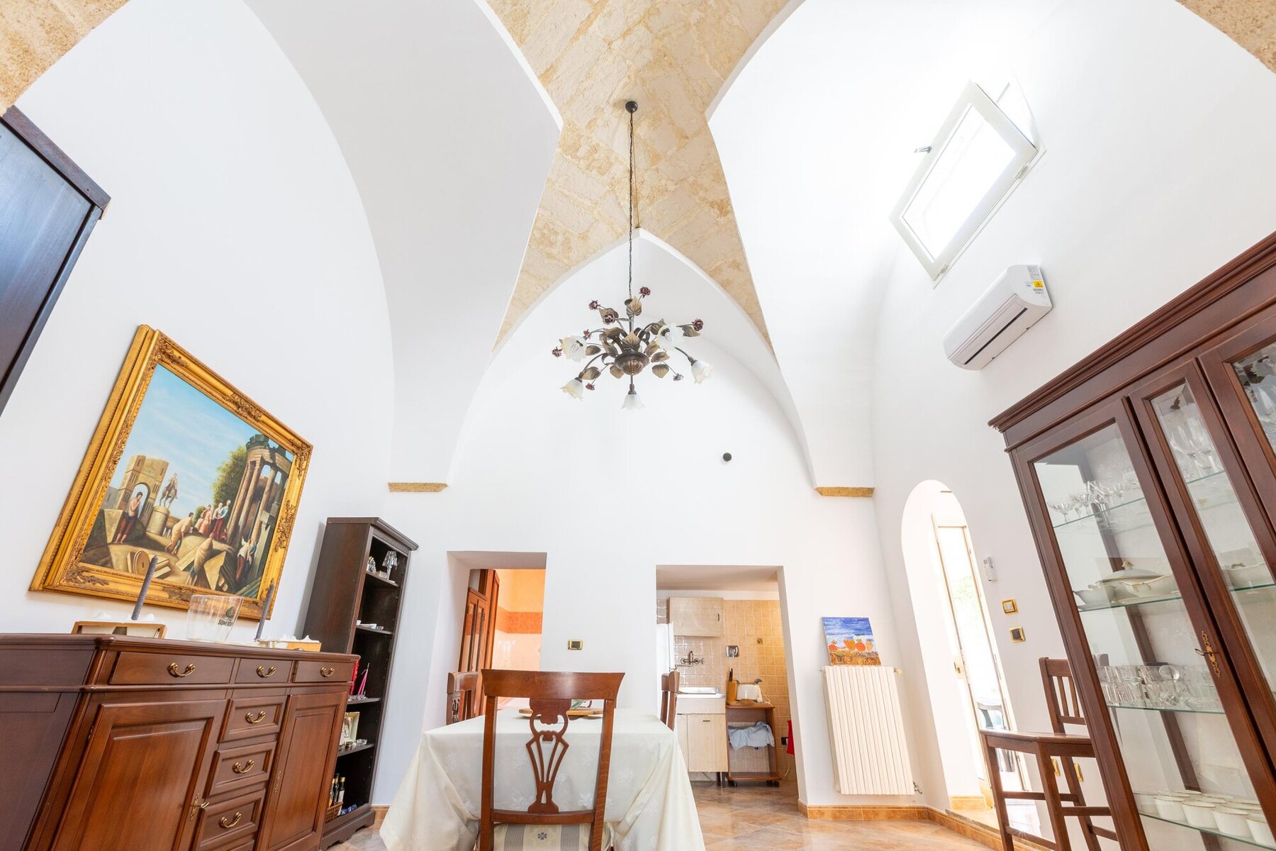 Dining room beneath a Puglian star vault